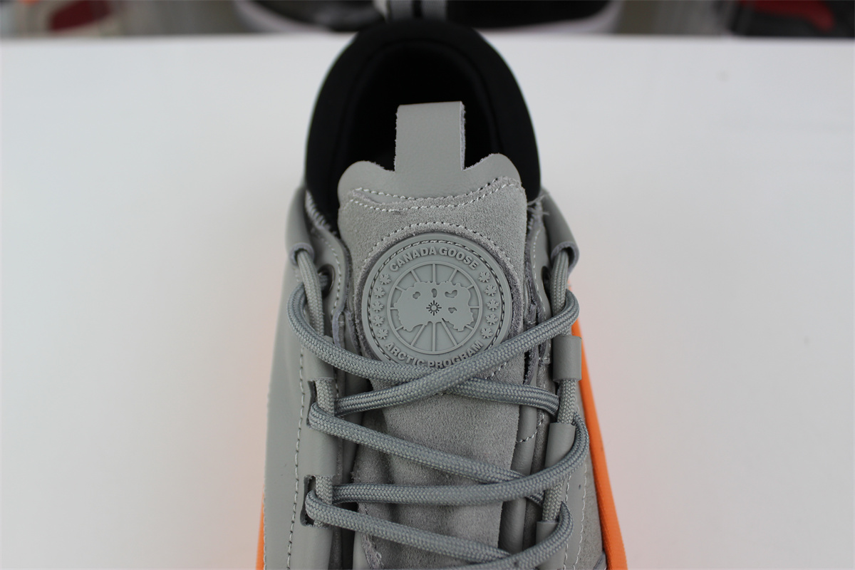 Can*a Go*e glacier trail sneaker grey orange