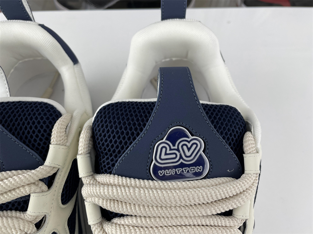 l**is V*t*n lv trainer dark blue four leaf clover